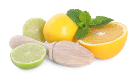 Photo of Wooden juicer, lime, lemon, orange and mint isolated on white