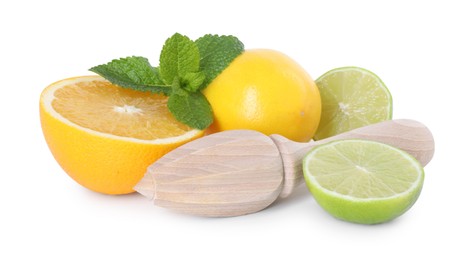 Photo of Wooden juicer, lime, lemon, orange and mint isolated on white