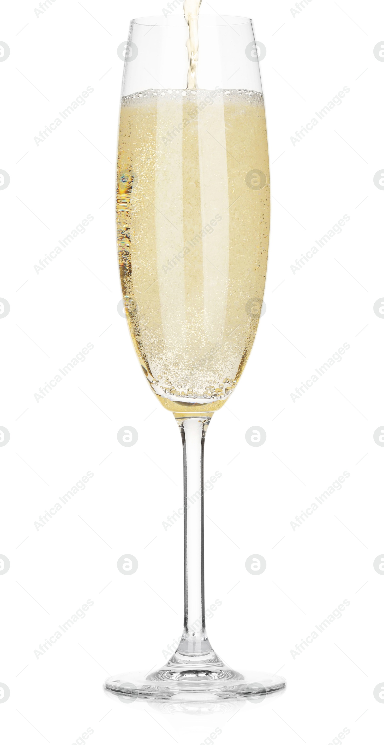 Photo of Pouring champagne into glass isolated on white