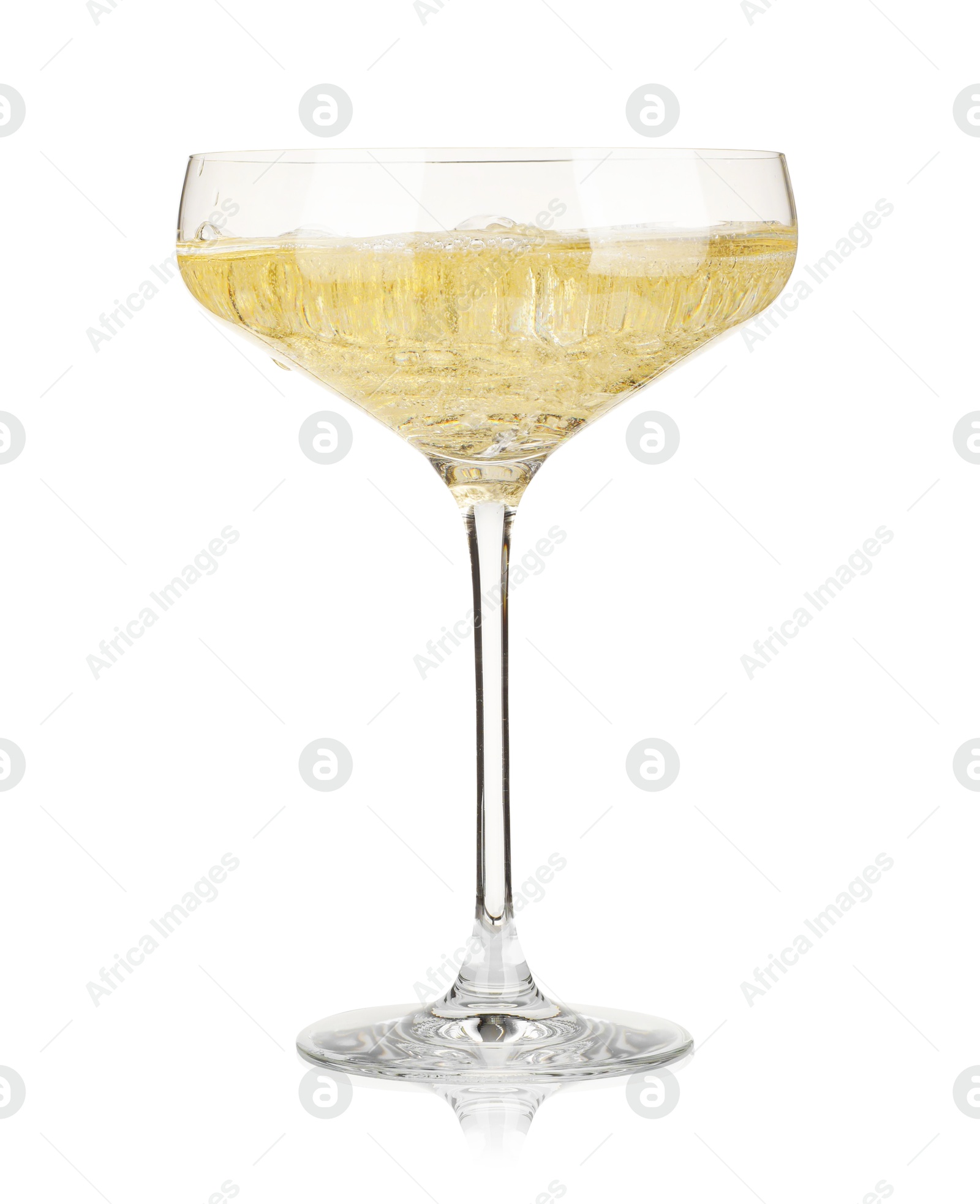 Photo of Pouring champagne into glass isolated on white