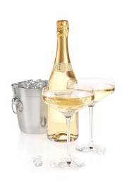 Photo of Champagne and bucket with ice isolated on white