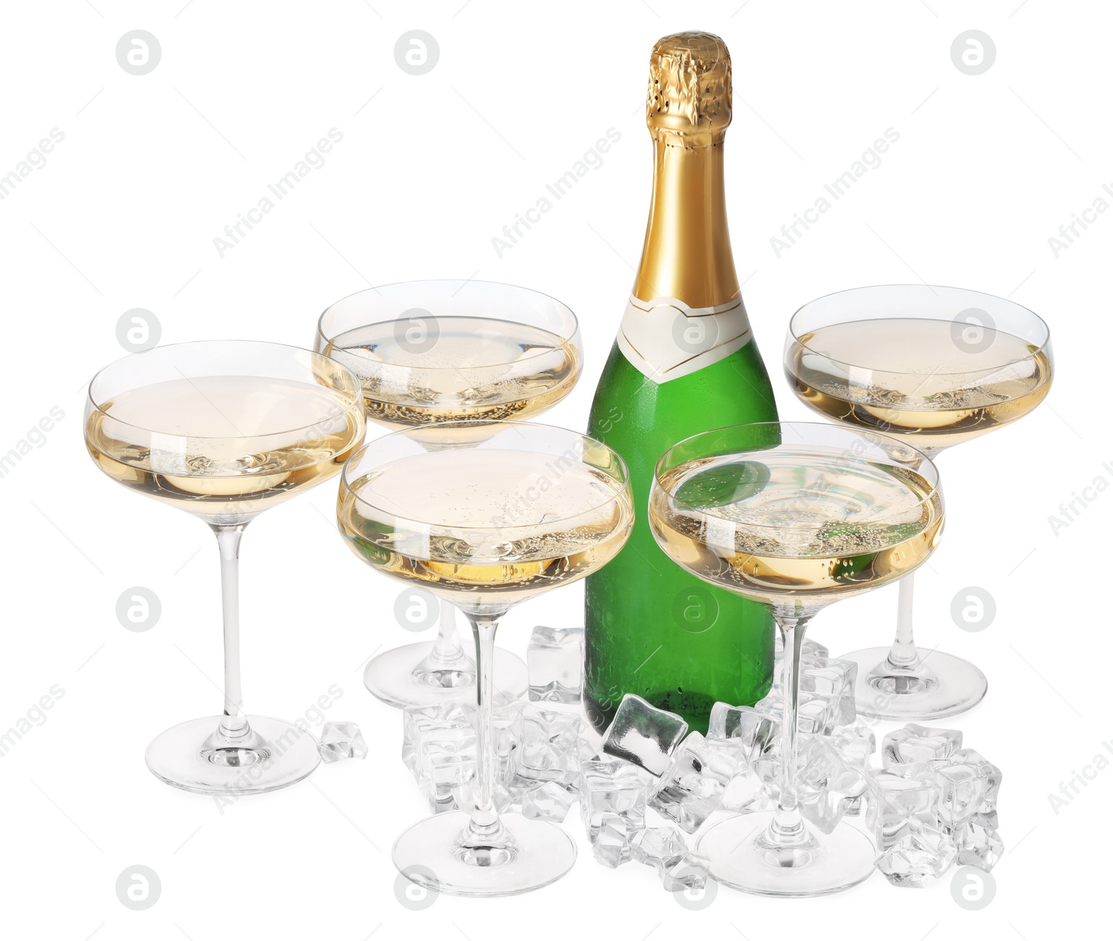 Photo of Bottle and glasses of champagne with ice cubes isolated on white