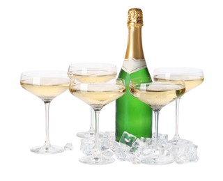 Photo of Bottle and glasses of champagne with ice cubes isolated on white