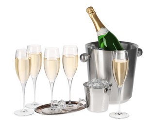 Photo of Champagne and buckets with ice isolated on white