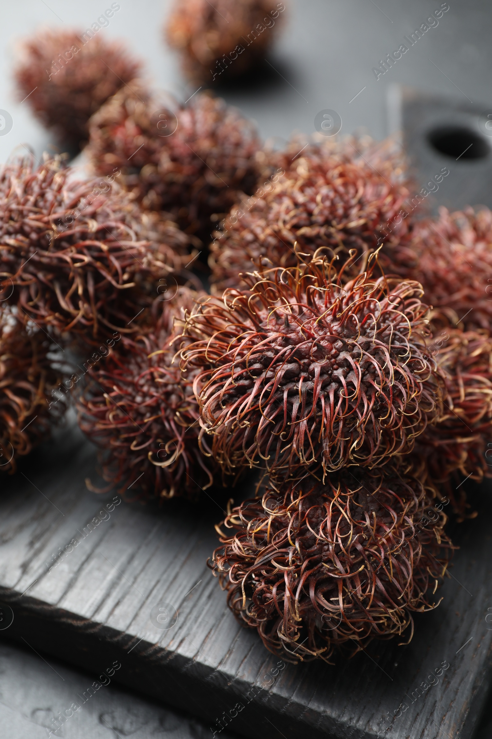 Photo of Many delicious ripe rambutans on table, closeup