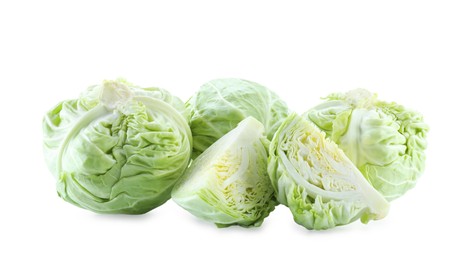 Photo of Whole and cut cabbages isolated on white