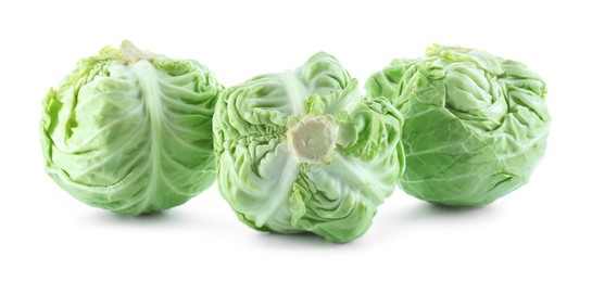 Photo of Three heads of cabbage isolated on white