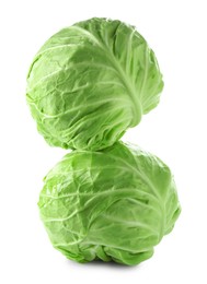 Photo of Two whole heads of cabbage isolated on white