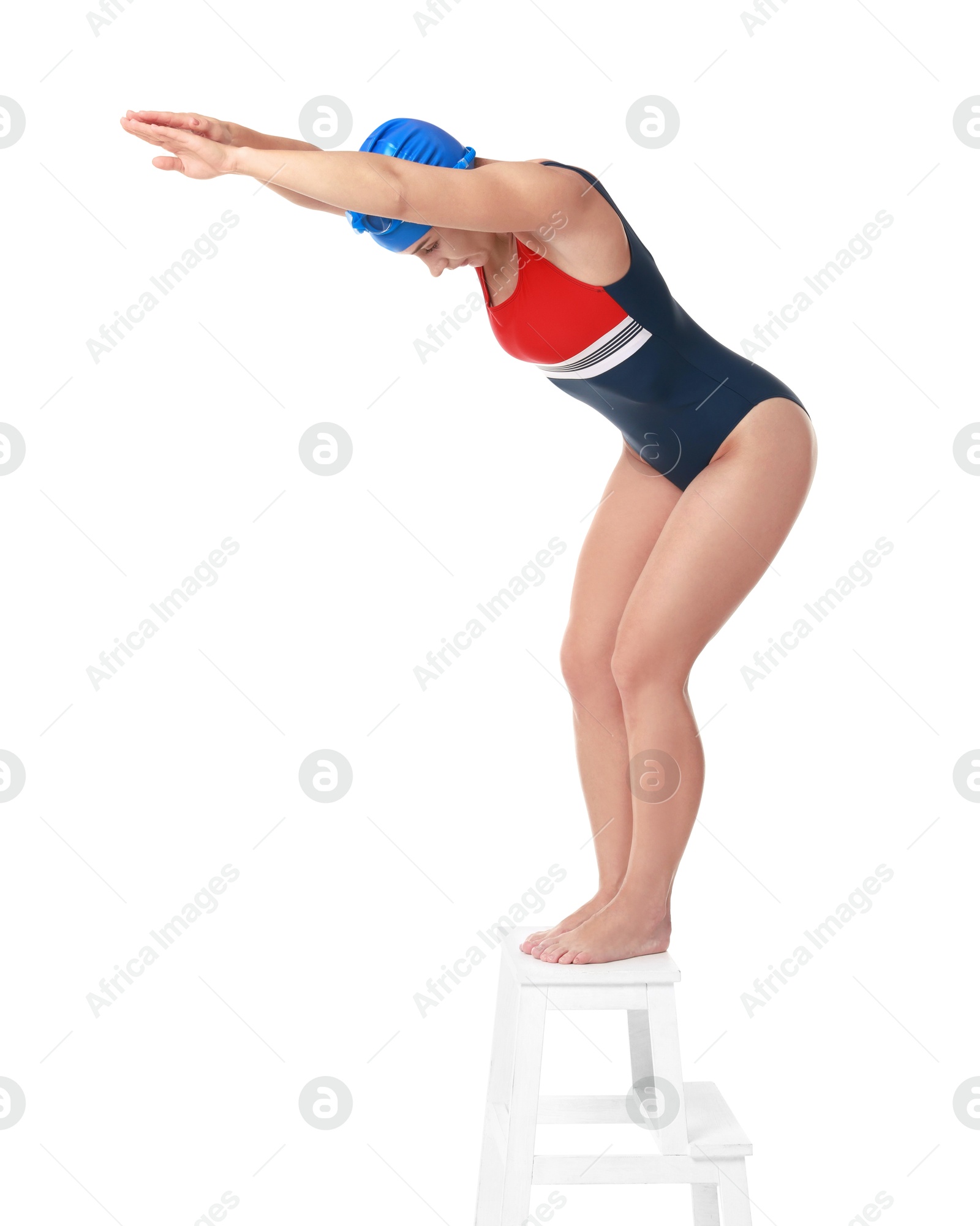 Photo of Professional sportswoman in swimsuit and cap jumping on white background