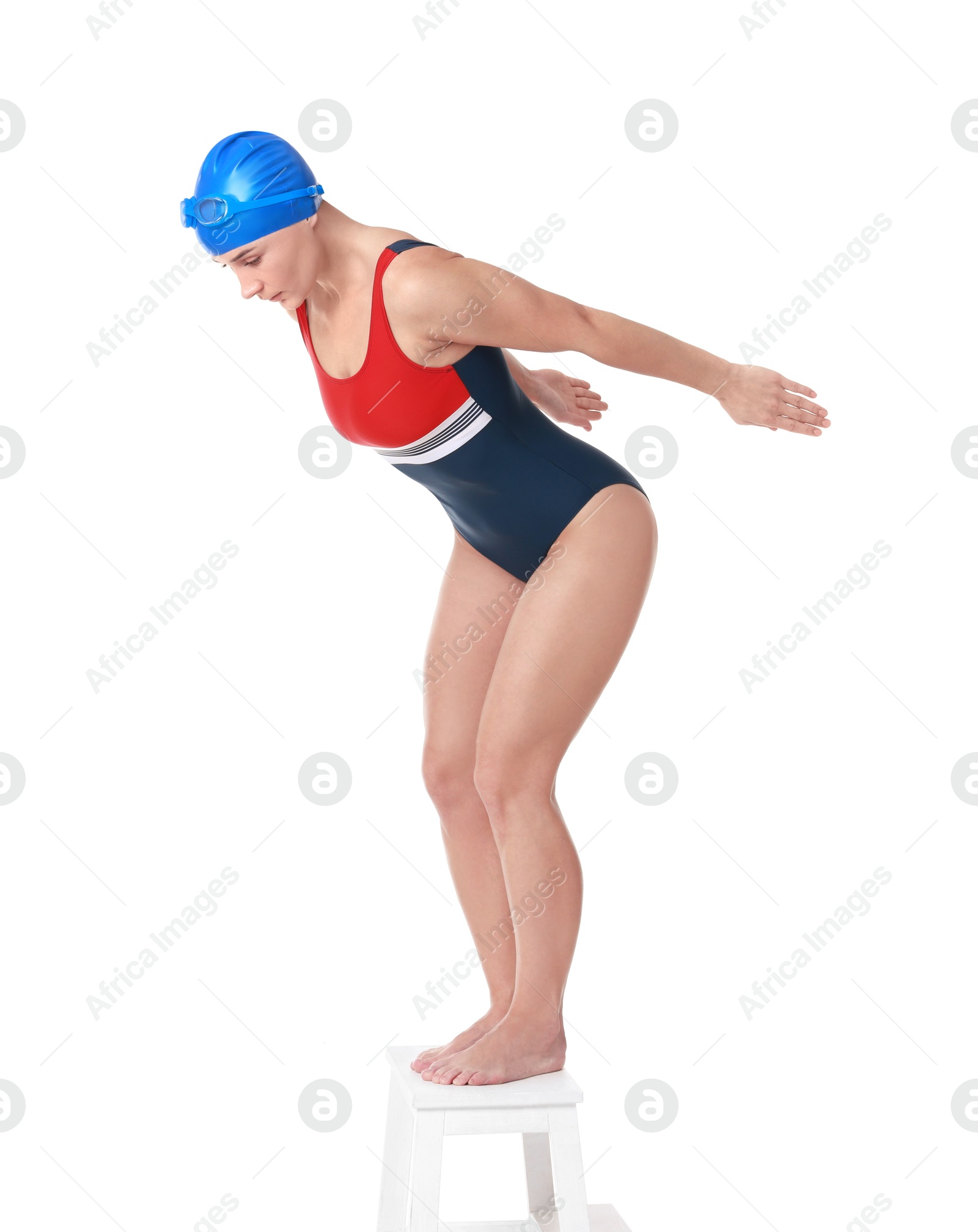 Photo of Professional sportswoman in swimsuit and cap jumping on white background