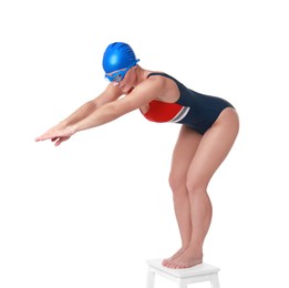 Photo of Professional sportswoman in swimsuit, cap and goggles jumping on white background