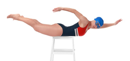 Photo of Professional sportswoman in swimsuit, cap and goggles swimming on white background