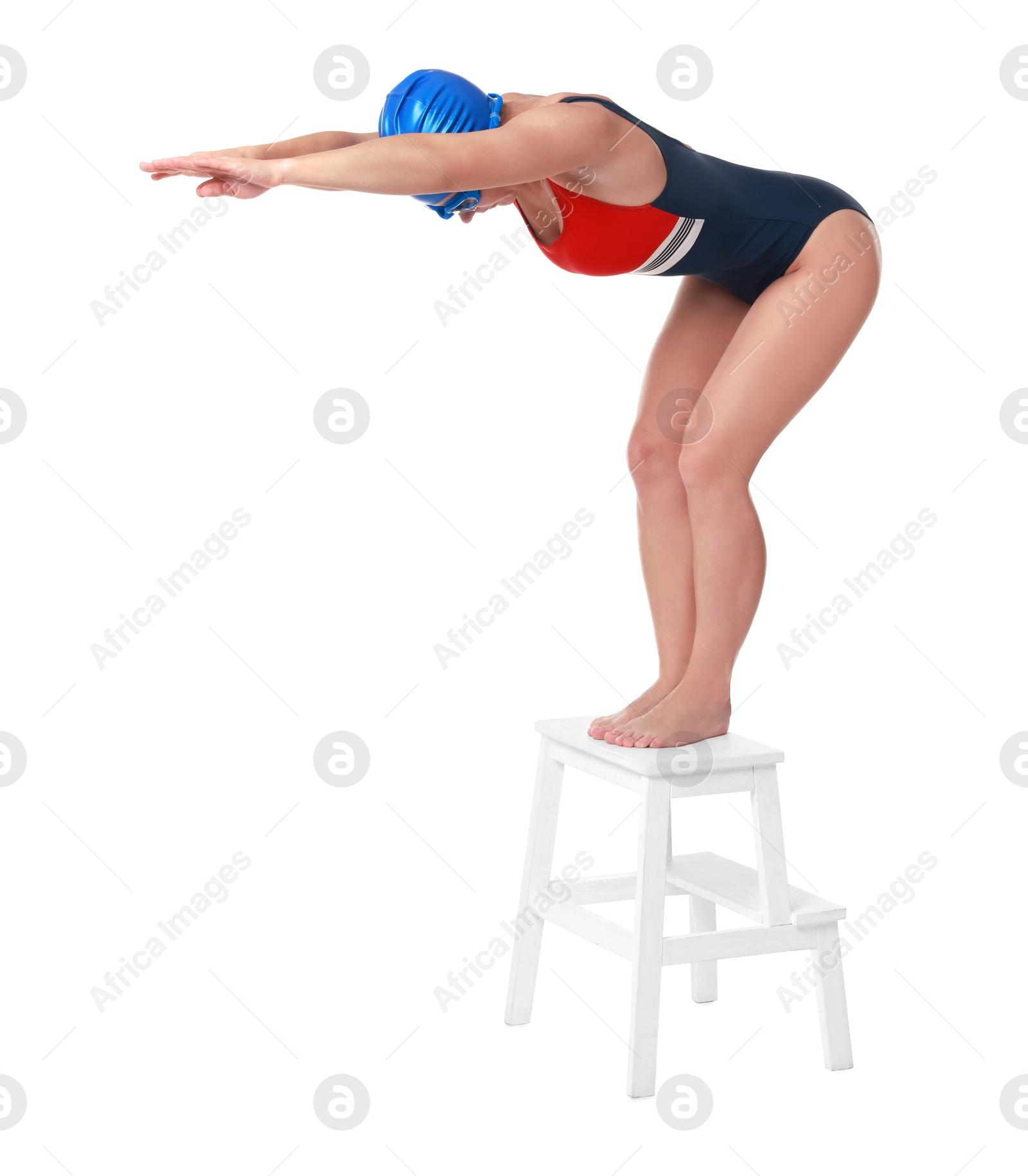 Photo of Professional sportswoman in swimsuit, cap and goggles jumping on white background