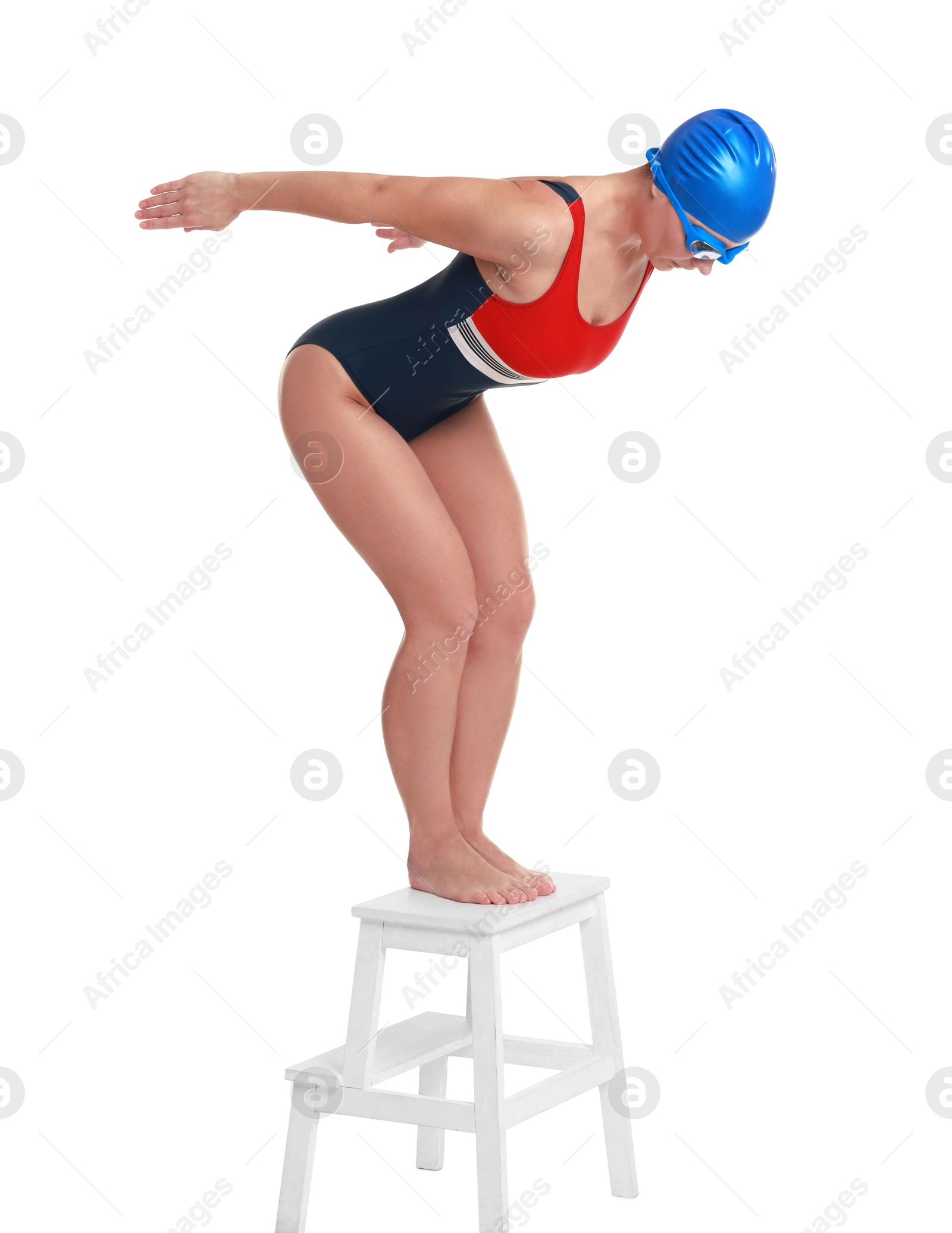 Photo of Professional sportswoman in swimsuit, cap and goggles jumping on white background