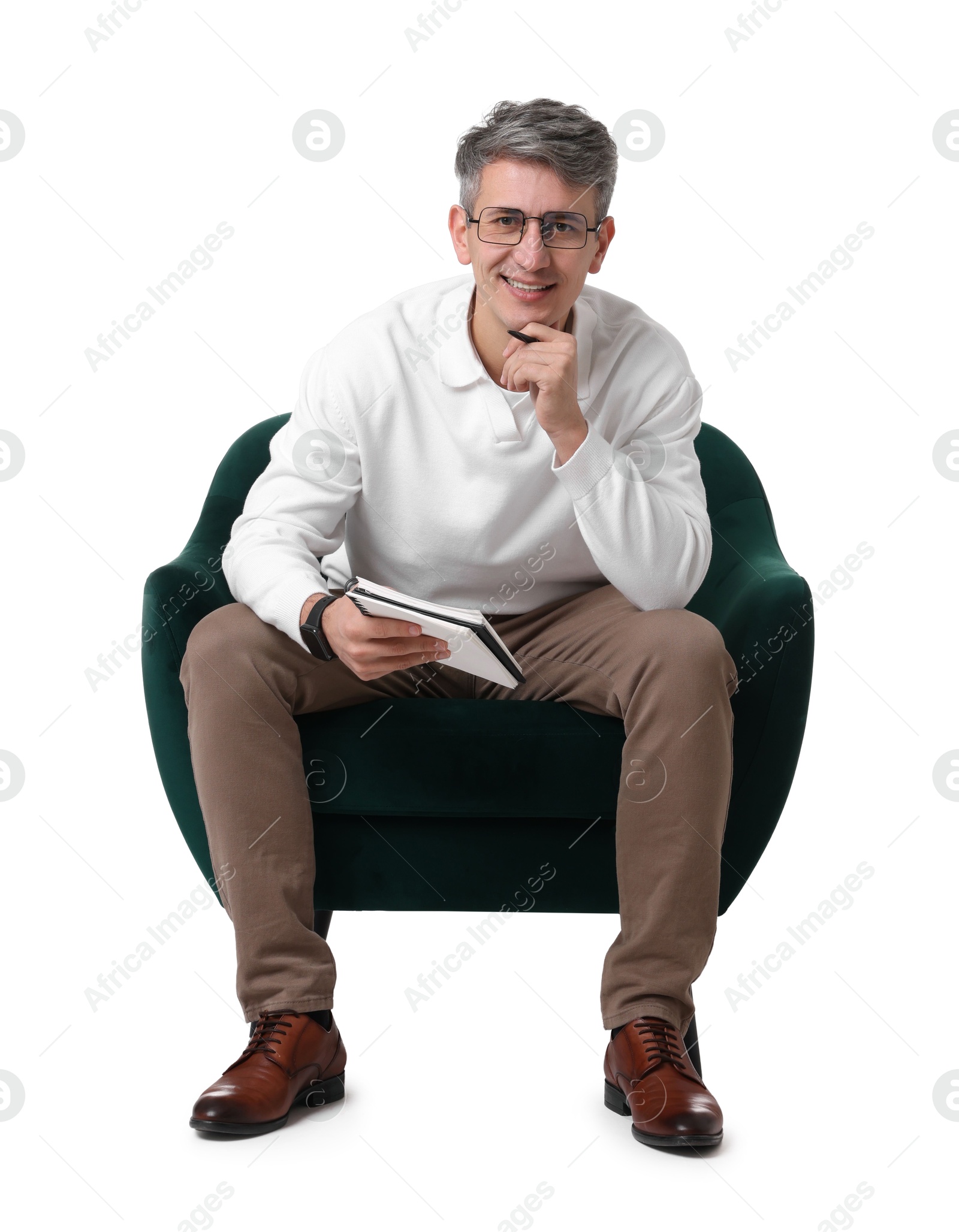 Photo of Professional psychologist with notebook sitting on chair against white background