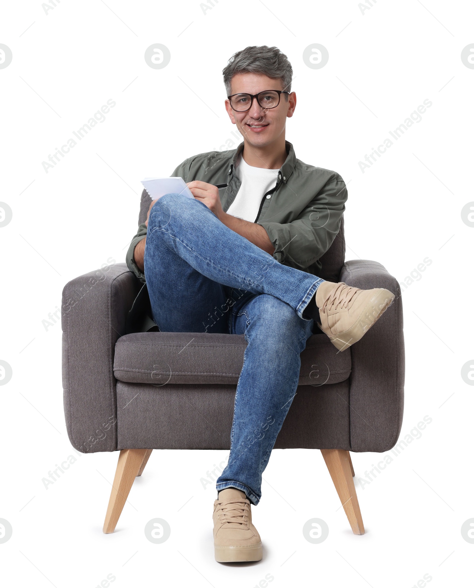 Photo of Professional psychologist with notebook sitting on chair against white background