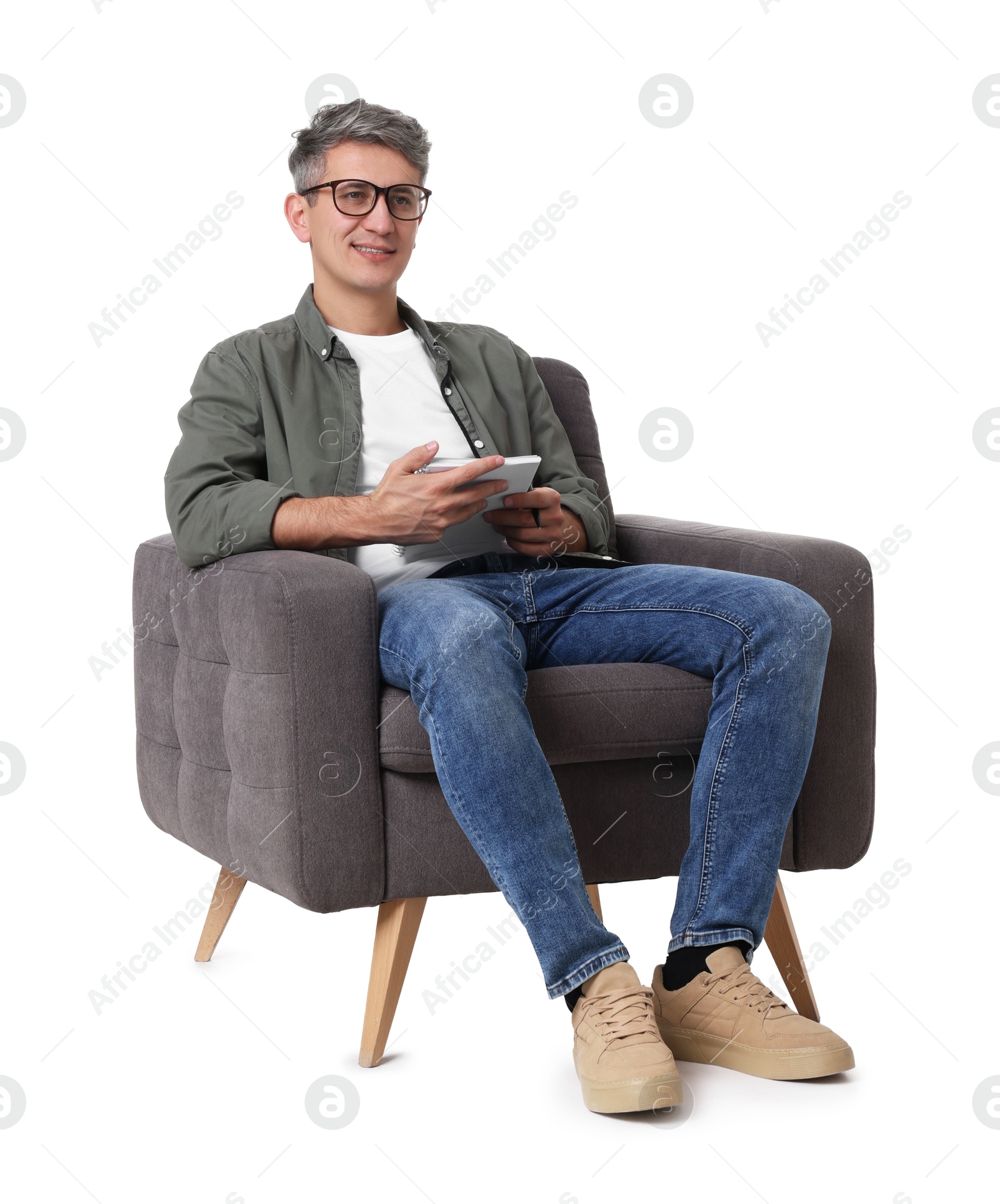 Photo of Professional psychologist with notebook sitting on chair against white background