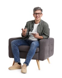 Photo of Professional psychologist with notebook sitting on chair against white background