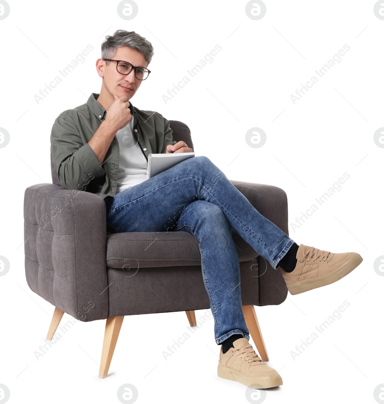 Photo of Professional psychologist with notebook sitting on chair against white background