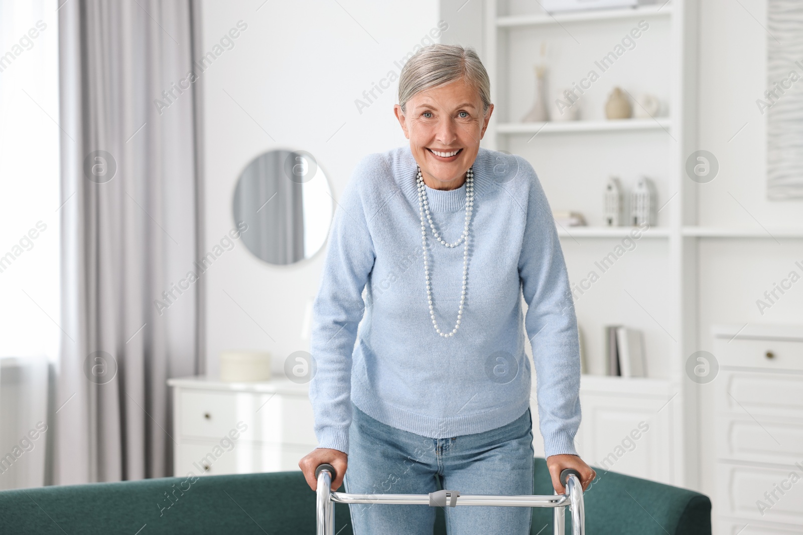 Photo of Senior woman with walking frame at home