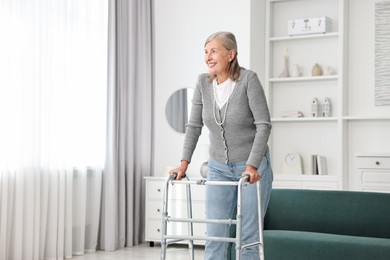 Photo of Senior woman with walking frame at home