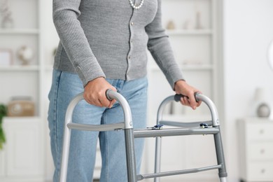 Senior woman with walking frame at home, closeup