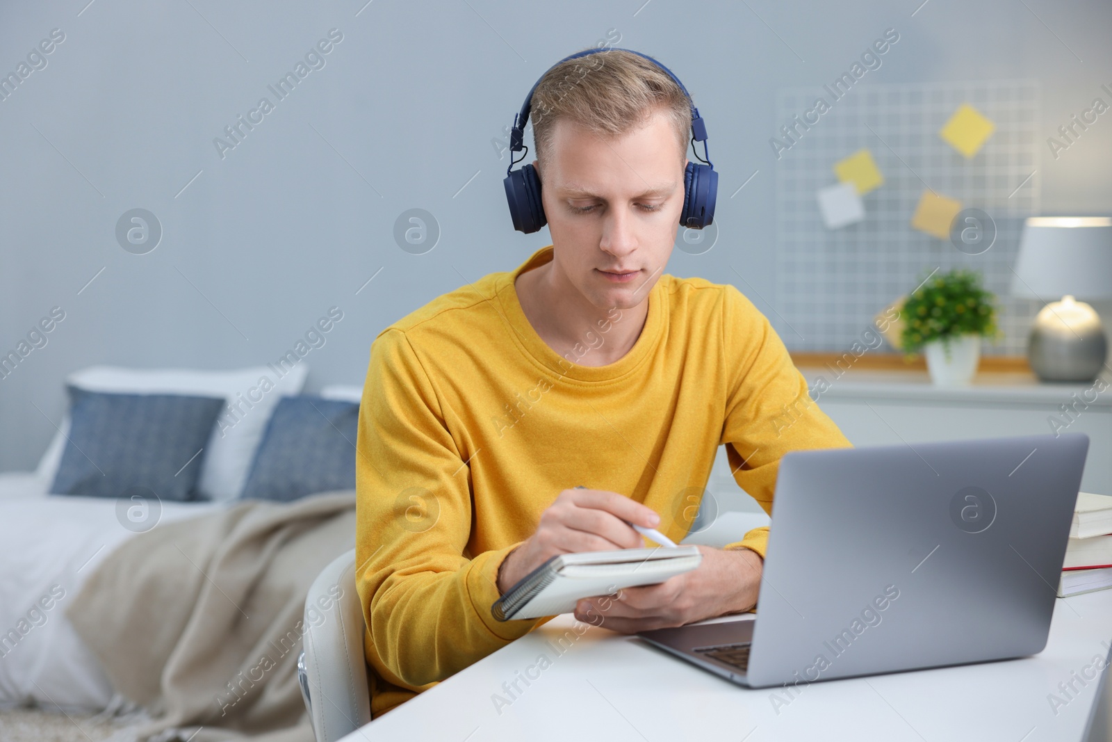 Photo of Student preparing for exam at table indoors