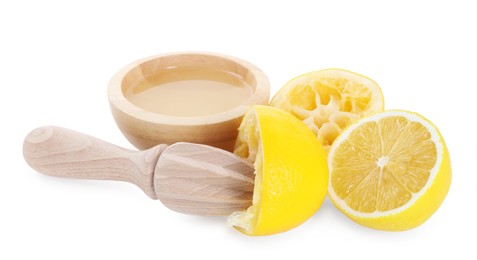 Photo of Fresh lemon juice in bowl, squeezer and fruits isolated on white