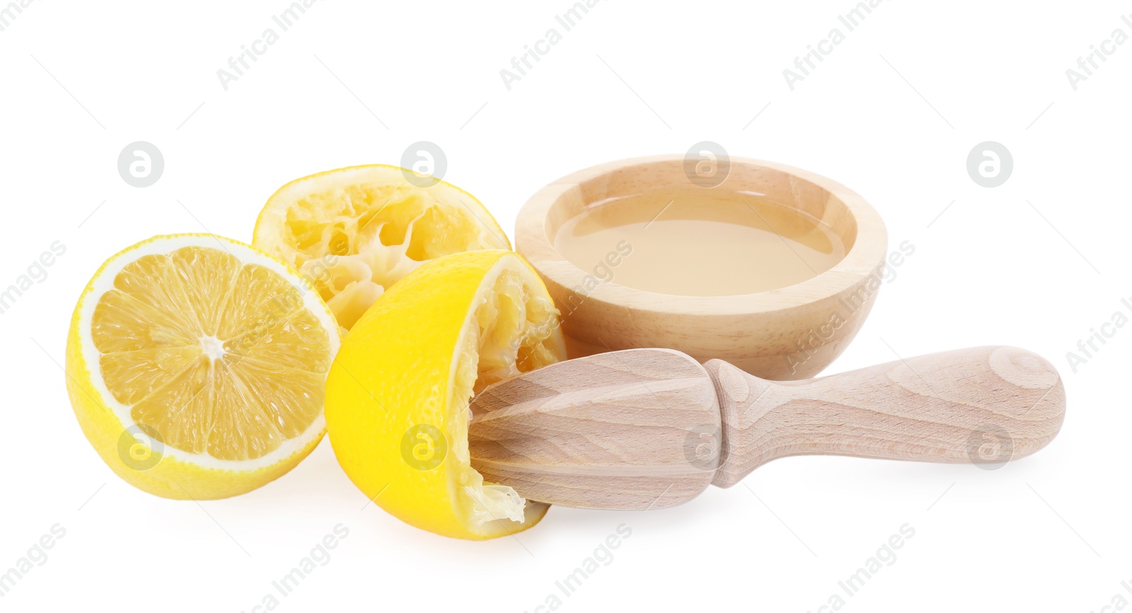 Photo of Fresh lemon juice in bowl, squeezer and fruits isolated on white