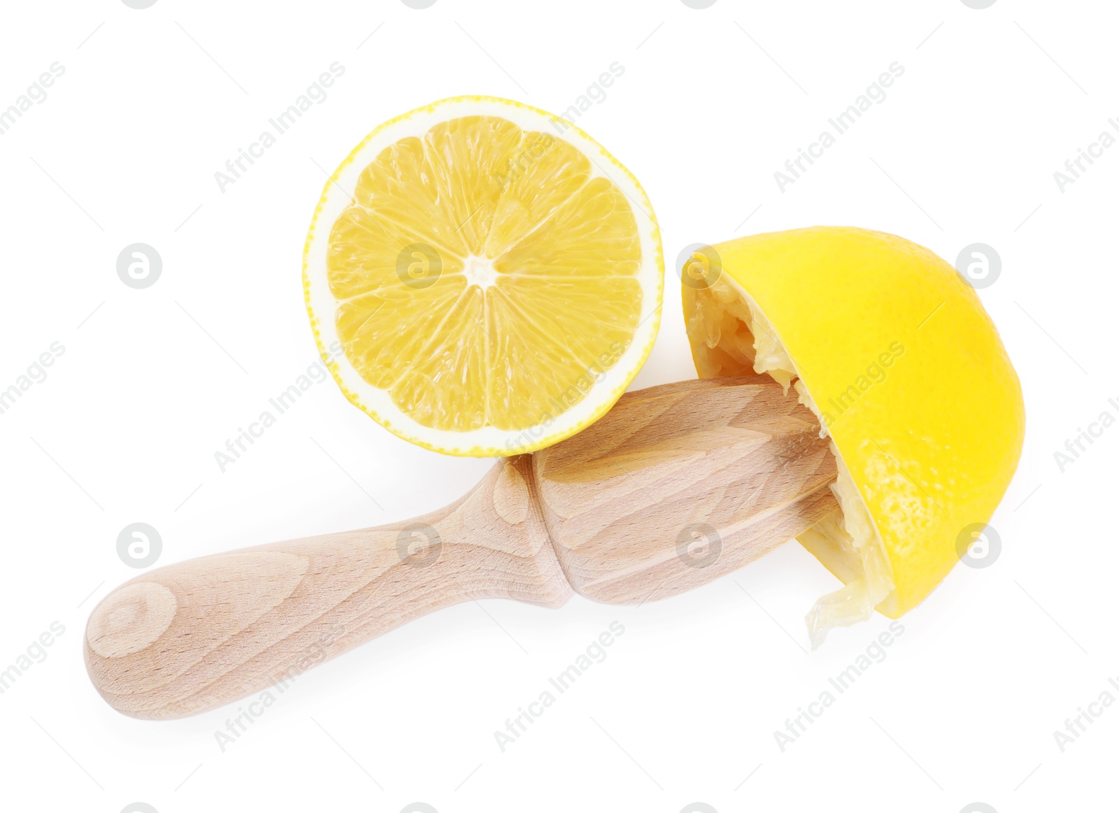 Photo of Wooden squeezer and halves of lemon isolated on white, top view