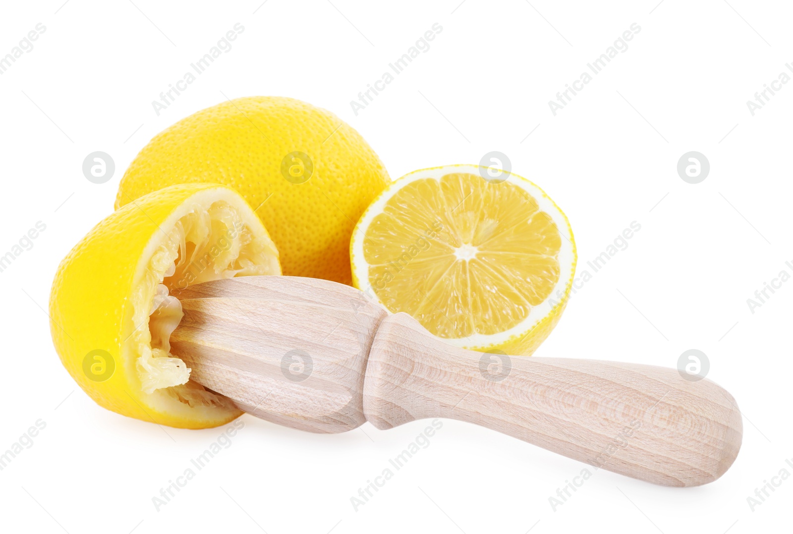 Photo of Wooden squeezer and lemons isolated on white