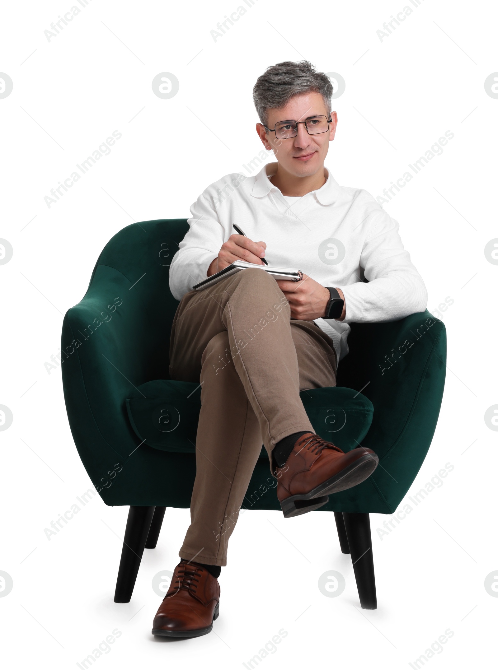 Photo of Professional psychologist with notebook sitting on chair against white background