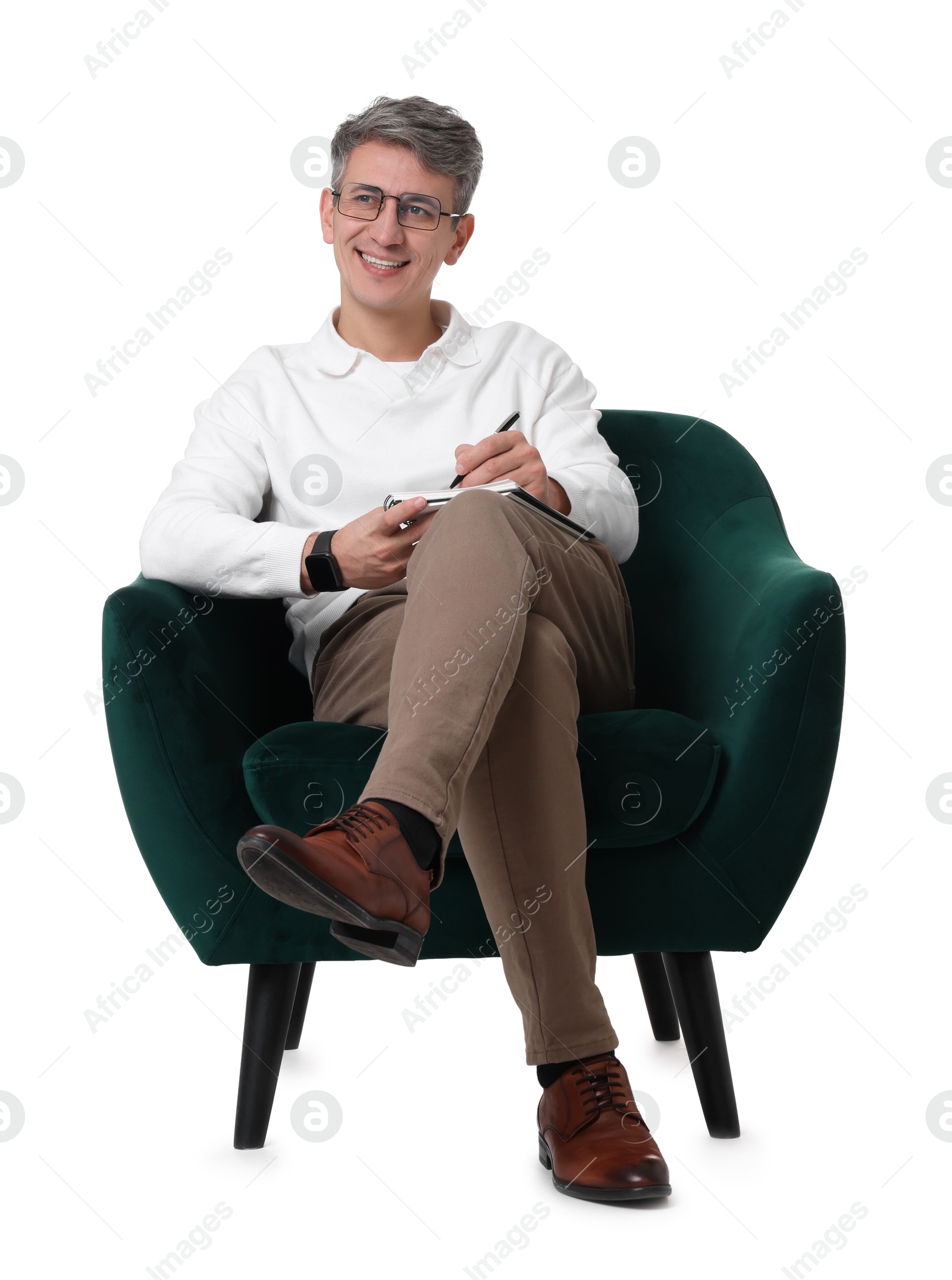 Photo of Professional psychologist with notebook sitting on chair against white background