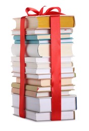 Photo of Stack of books with red ribbon as gift isolated on white