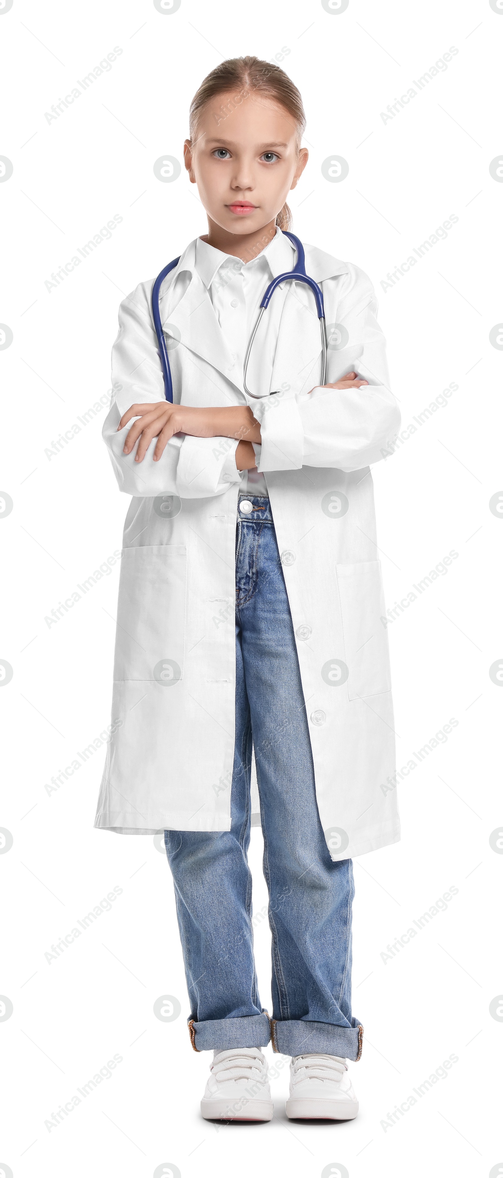 Photo of Girl with stethoscope pretending to be doctor on white background. Dreaming of future profession