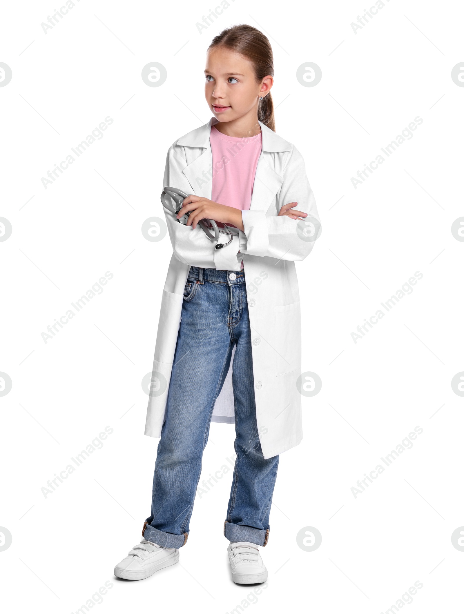 Photo of Girl with stethoscope pretending to be doctor on white background. Dreaming of future profession