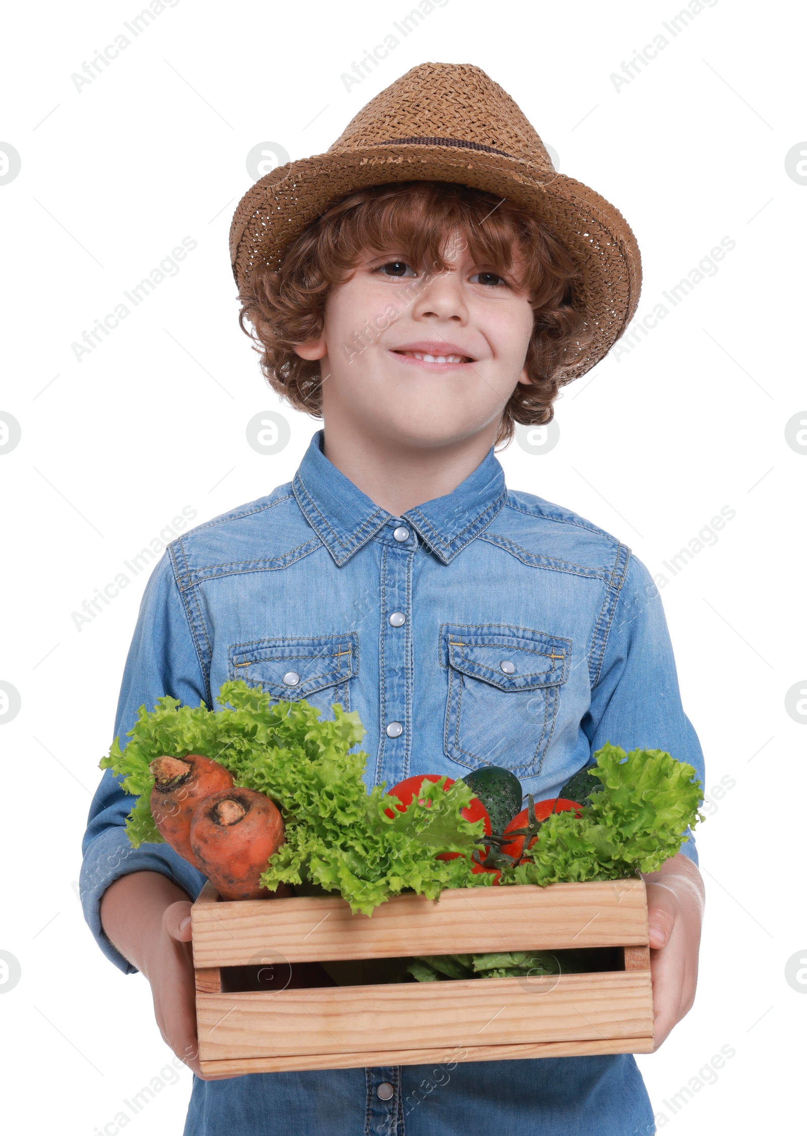 Photo of Little boy with vegetables pretending to be farmer on white background. Dreaming about future profession