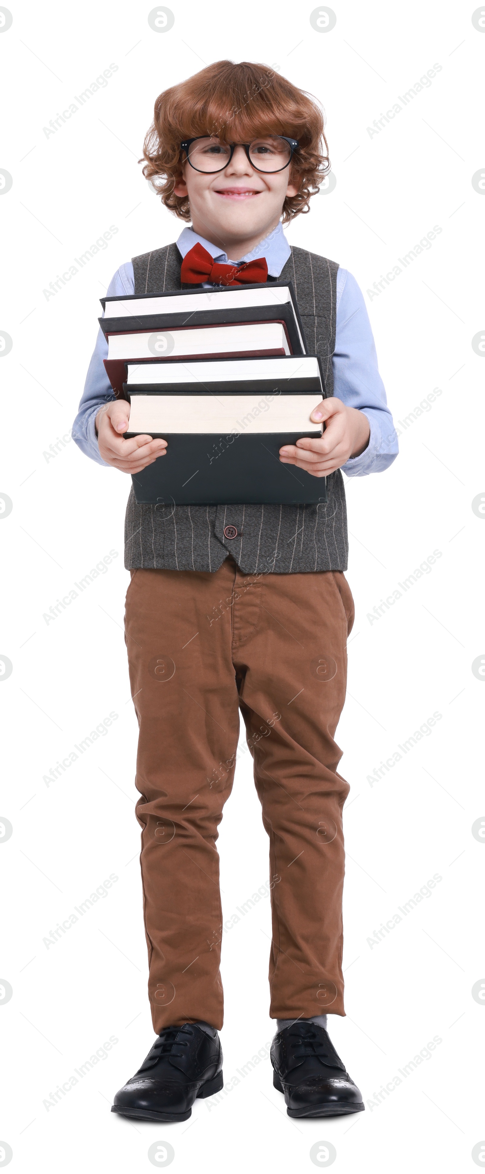 Photo of Little boy with books pretending to be teacher on white background. Dreaming about future profession