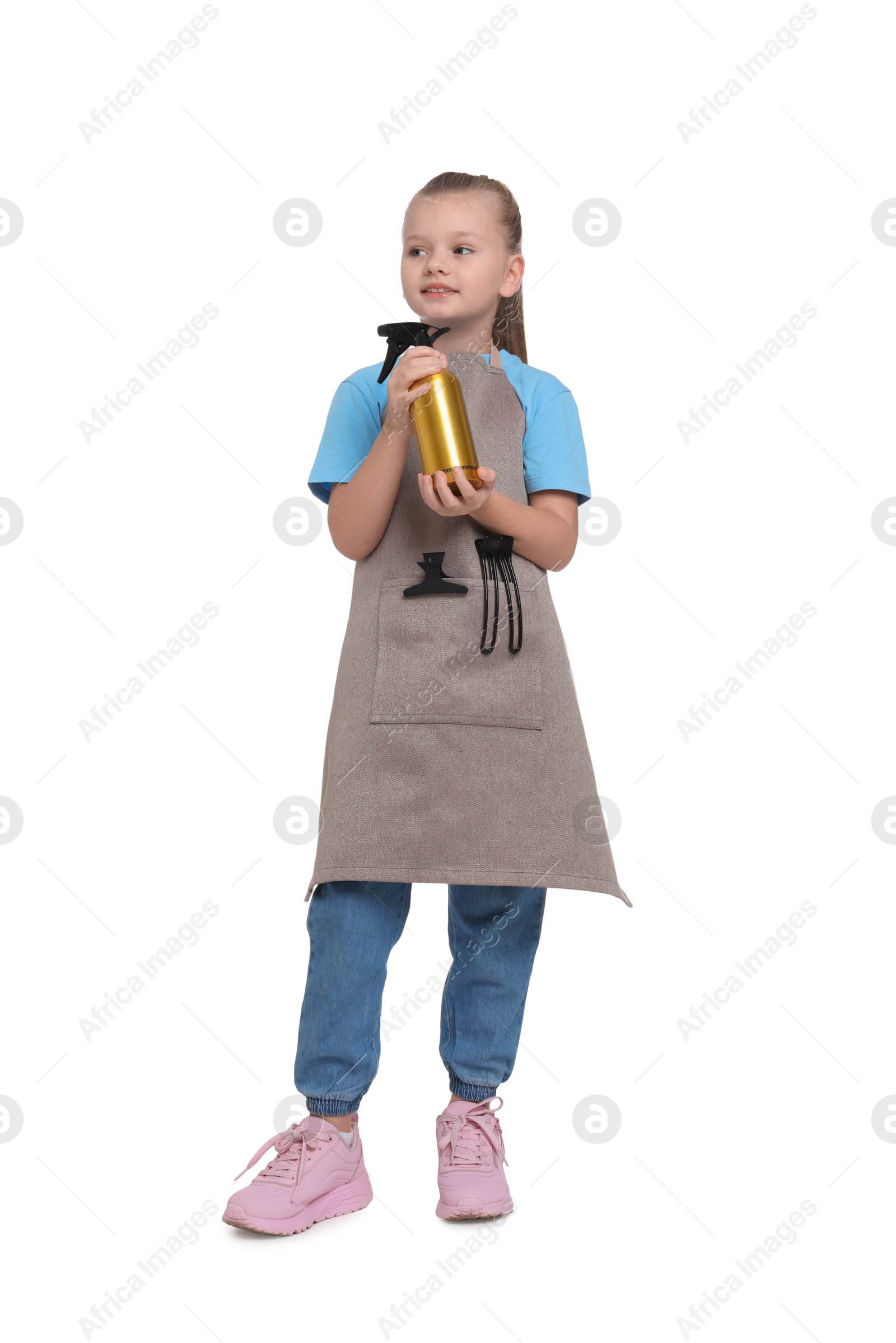 Photo of Little girl with sprayer pretending to be hairdresser on white background. Dreaming of future profession