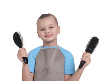 Photo of Little girl with brushes pretending to be hairdresser on white background. Dreaming of future profession