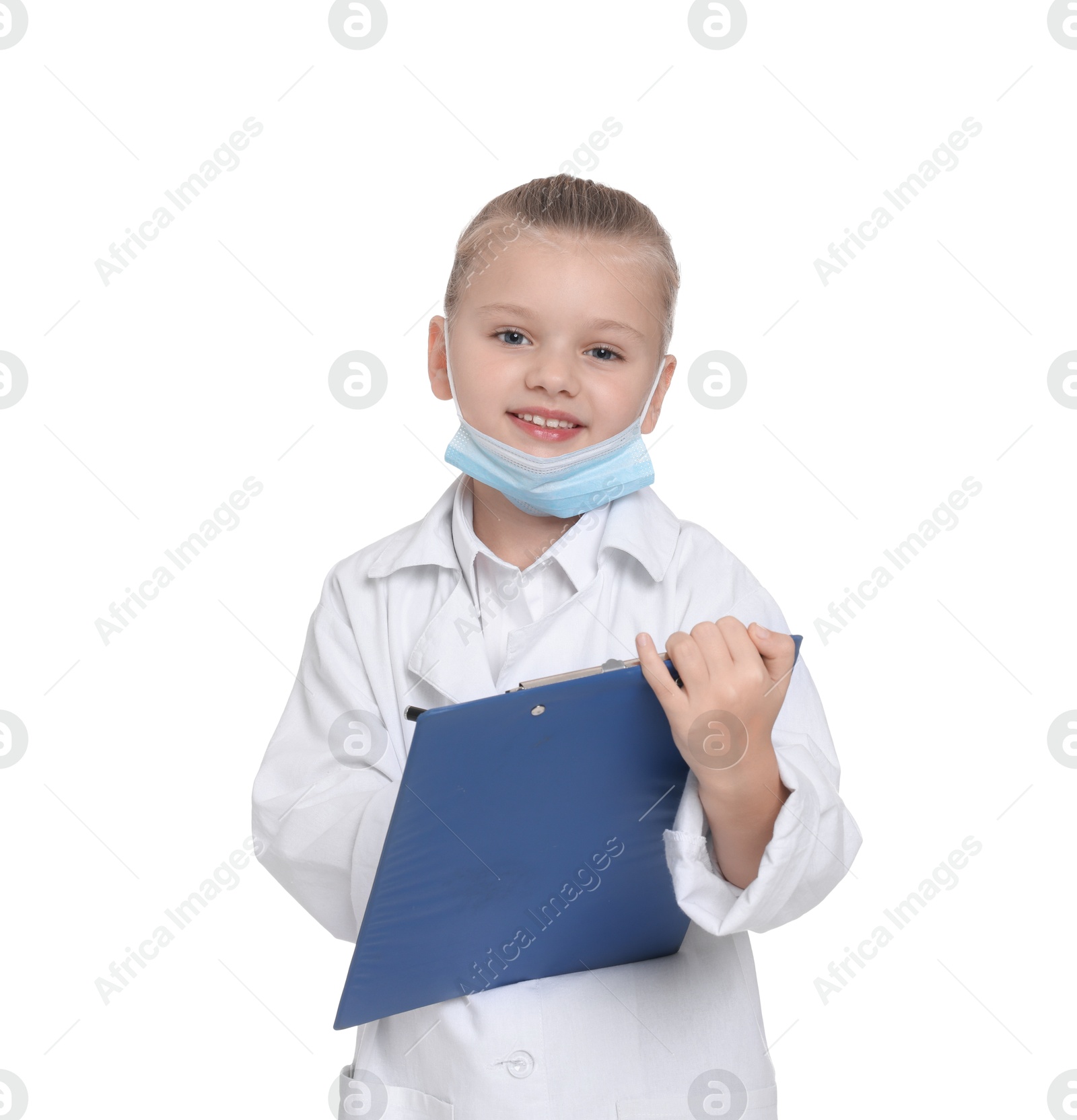 Photo of Little girl with protective mask and clipboard pretending to be doctor on white background. Dreaming of future profession