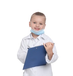 Photo of Little girl with protective mask and clipboard pretending to be doctor on white background. Dreaming of future profession