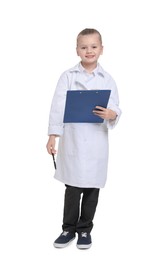 Photo of Little girl with clipboard and pen pretending to be doctor on white background. Dreaming of future profession