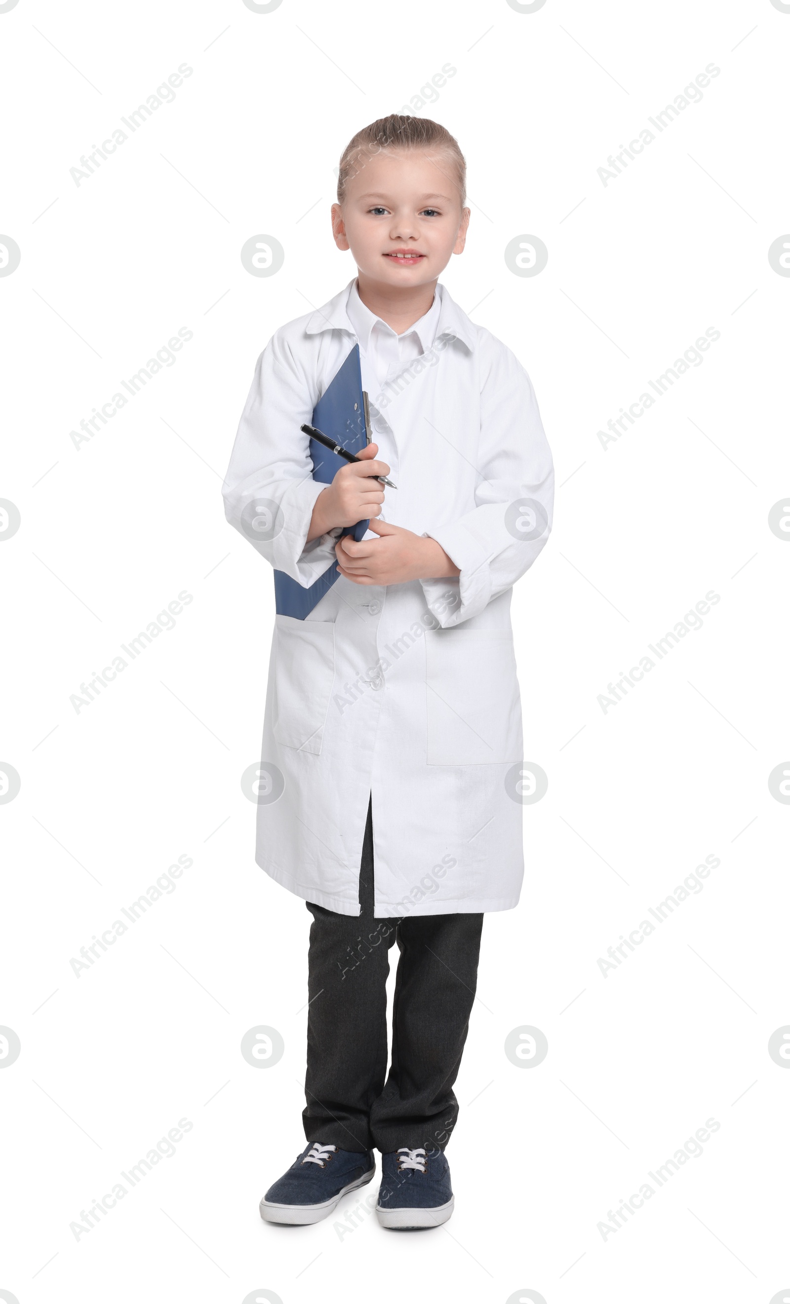 Photo of Little girl with clipboard and pen pretending to be doctor on white background. Dreaming of future profession