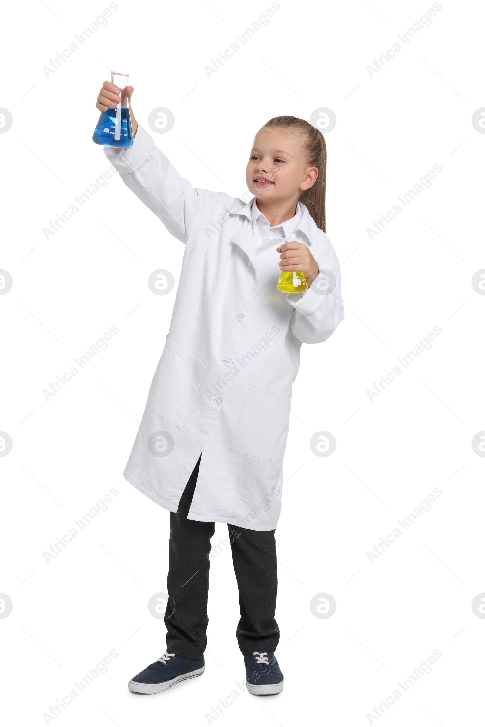 Photo of Little girl with glassware pretending to be scientist on white background. Dreaming of future profession