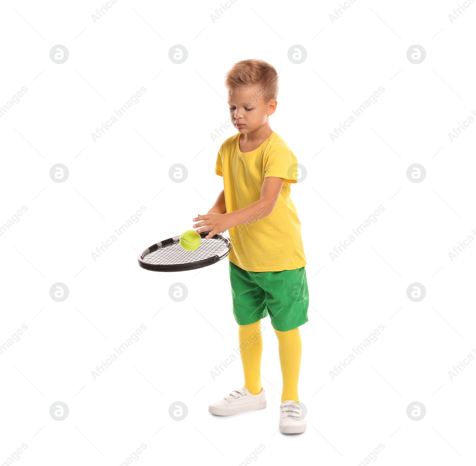 Photo of Little boy with tennis racket and ball on white background