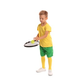 Photo of Little boy with tennis racket and ball on white background