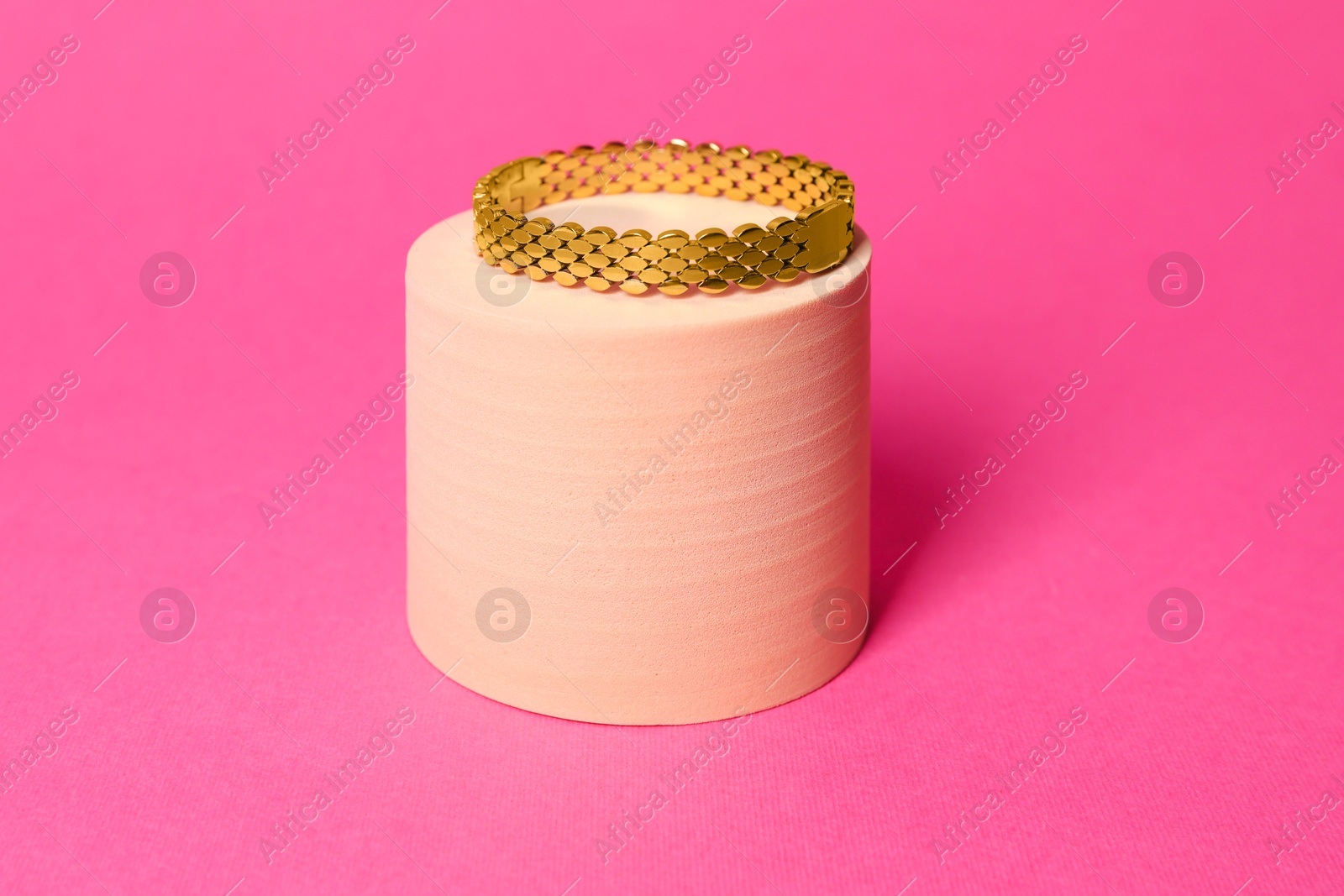 Photo of Stylish presentation of beautiful bracelet on pink background