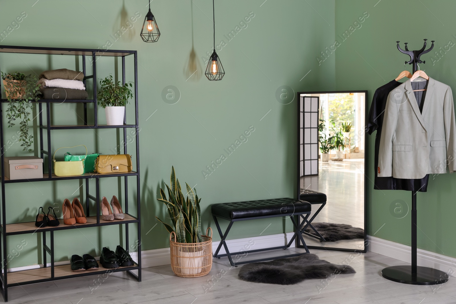 Photo of Stylish hallway interior with mirror and shelving unit