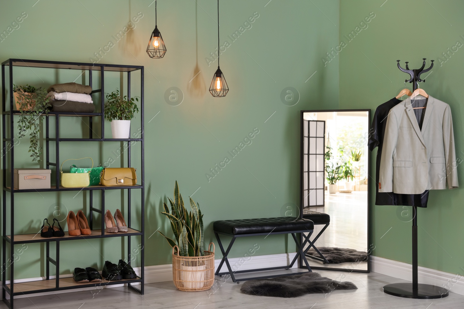 Photo of Stylish hallway interior with mirror and shelving unit